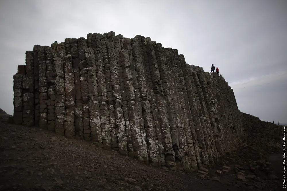 Visitors Enjoy the Ancient Basalt Columns that form the Giants Causeway