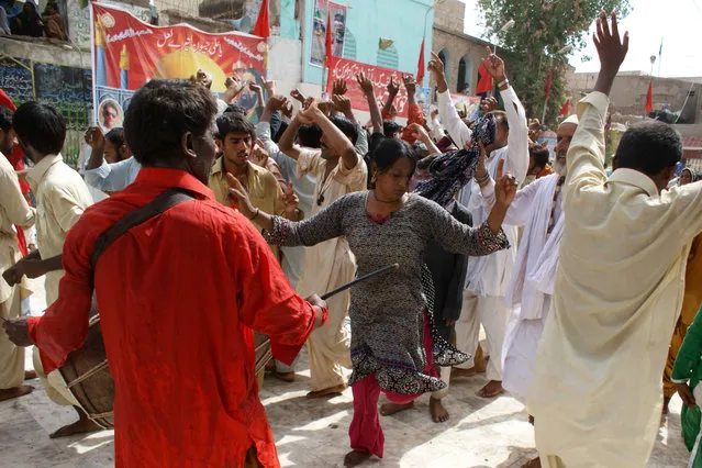 A devotee dances during the annual celebrations at the shrine of Muslim Sufi Saint Hazrat Lal Shahbaz Qalandar in Sehwan Sharif, Pakistan, 09 July 2012. Hazrat Lal Shahbaz Qalandar (1177-1274) was a Persian (Tajik) Sufi saint, philosopher, poet, and qalandar. Born Syed Usman Shah Marwandi, he belonged to the Suhrawardiyya order of Sufis. He preached religious tolerance among Muslims and Hindus. Thousands of pilgrims visit his shrine every year, especially on the occasion of his Urs. (Photo by Nadeem Khawer/EPA)