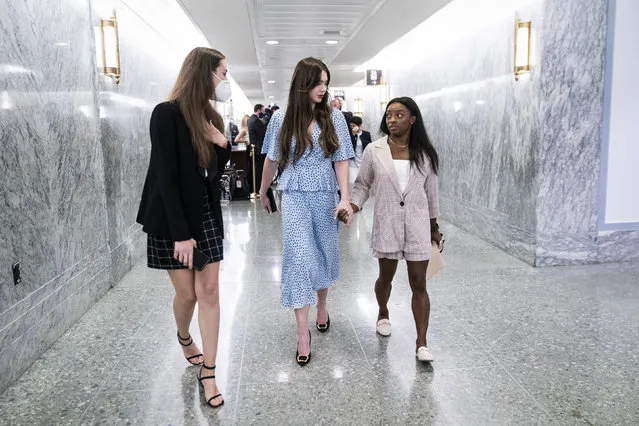 United States gymnasts Simone Biles and McKayla Maroney hold hands after testifying during a Senate Judiciary hearing about the Inspector General's report on the FBI's handling of the Larry Nassar investigation on Capitol Hill on Wednesday, September 15, 2021 in Washington, DC. (Photo by Jabin Botsford/The Washington Post)