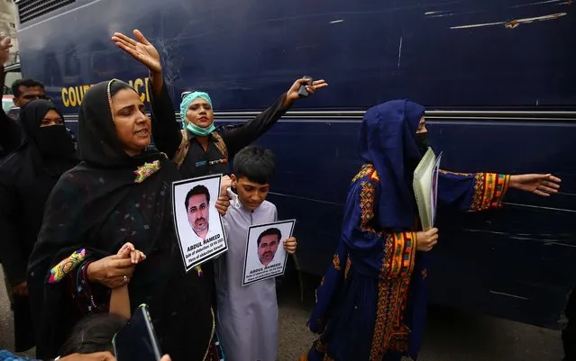 Family members hold pictures of their missing relatives during a protest  demanding the deliverance of their relatives, in Karachi, Pakistan, 24 May 2022. People demanded the deliverance of their missing relatives whom Pakistani human rights activists claim have been picked up by state agencies, primarily under the pretext of fighting terrorism. (Photo by Shahzaib Akber/EPA/EFE)