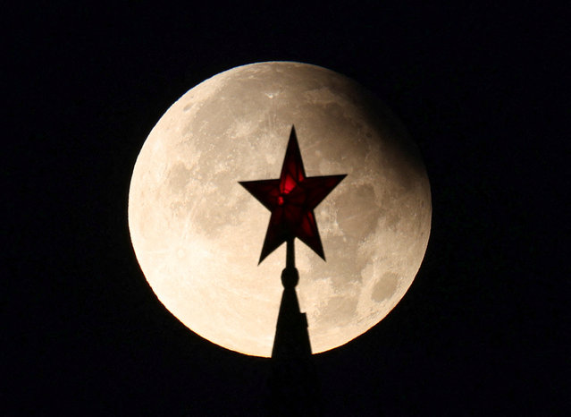 A star atop of the tower of the Kremlin is seen against partial lunar eclipse, in Moscow, Russia on September 18, 2024. (Photo by Marina Lystseva/Reuters)