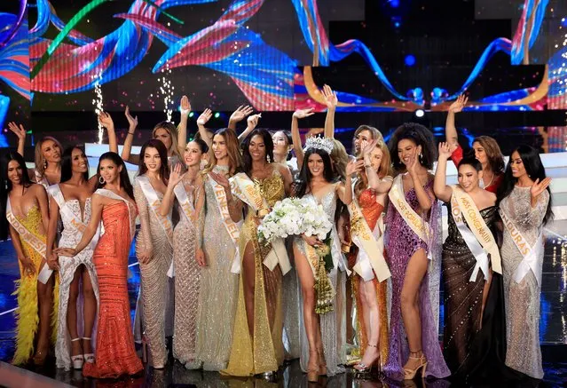 Crown Winner Fuschia Anne Ravena of the Philippines and other contestants wave after Miss International Queen 2022 transgender beauty pageant in Pattaya City, Thailand on June 25, 2022. (Photo by Soe Zeya Tun/Reuters)