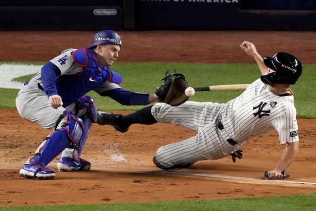 New York Yankees' Giancarlo Stanton is tagged out at home by Los Angeles Dodgers catcher Will Smith during the fourth inning in Game 3 of the baseball World Series, Monday, October 28, 2024, in New York. (Photo by Frank Franklin II/AP Photo)