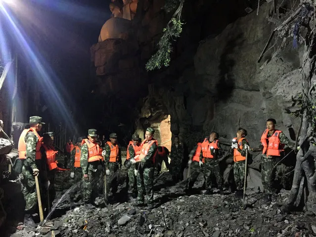 Chinese paramilitary police search for survivors after an earthquake in Jiuzhaigou county, Ngawa prefecture, Sichuan province, China August 9, 2017. (Photo by Reuters/China Stringer Network)