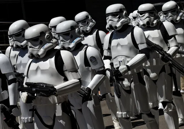 People wearing Star Wars stormtrooper costumes are seen during the parade in Metropoli (Media Culture and Entertainment Festival) in Gijon, northern Spain, July 3, 2016. (Photo by Eloy Alonso/Reuters)