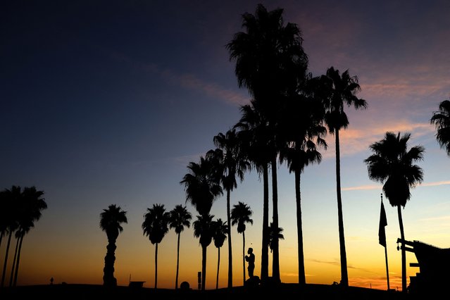 The sun sets over Venice Beach in Los Angeles, California on November 13, 2024. (Photo by Daniel Cole/Reuters)
