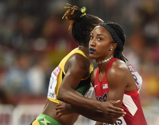 Brianna Rollins (R) embraces Shermaine Williams of Jamaica after their women's 100 metres hurdles semi-final during the 15th IAAF World Championships at the National Stadium in Beijing, China, August 28, 2015. (Photo by Dylan Martinez/Reuters)