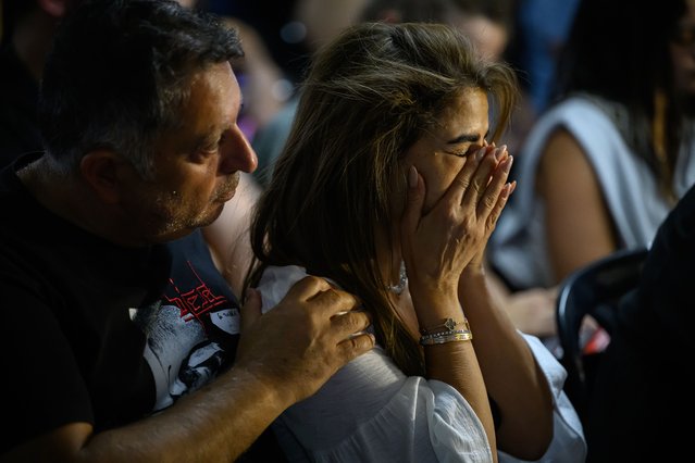 Family and friends of those taken hostage by Hamas during an attack on Israel react as they listen to speeches during a press conference on October 13, 2023 in Tel Aviv, Israel. Israel has sealed off Gaza and launched sustained retaliatory air strikes, which have killed at least 1,400 people with more than 300,000 displaced, after a large-scale attack by Hamas. On October 7, the Palestinian militant group Hamas launched a surprise attack on Israel from Gaza by land, sea, and air, killing over 1,300 people and wounding around 2,800. Israeli soldiers and civilians have also been taken hostage by Hamas and moved into Gaza. The attack prompted a declaration of war by Israeli Prime Minister Benjamin Netanyahu and the announcement of an emergency wartime government. (Photo by Leon Neal/Getty Images)