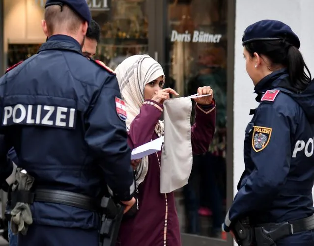 A police patrol in Zell am See, Austria on Sunday, October 1, 2017. Items which cover the face, including the full Islamic veil, masks and scarves, have been outlawed in public places. Anyone flouting the law faces a fine of 150 euros. People are only allowed to wear them for special events or celebrations. Announcing the ban, officials in Vienna claimed it would encourage “acceptance and respect of Austrian values”. (Photo by Barbara Gindl/AFP Photo/APA)