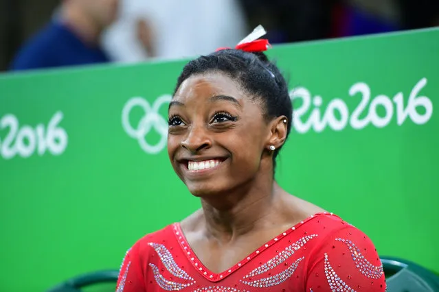 US gymnast Simone Biles smiles during a practice session of the women's Artistic gymnastics at the Olympic Arena on August 4, 2016 ahead of the Rio 2016 Olympic Games in Rio de Janeiro. (Photo by Emmanuel Dunand/AFP Photo)