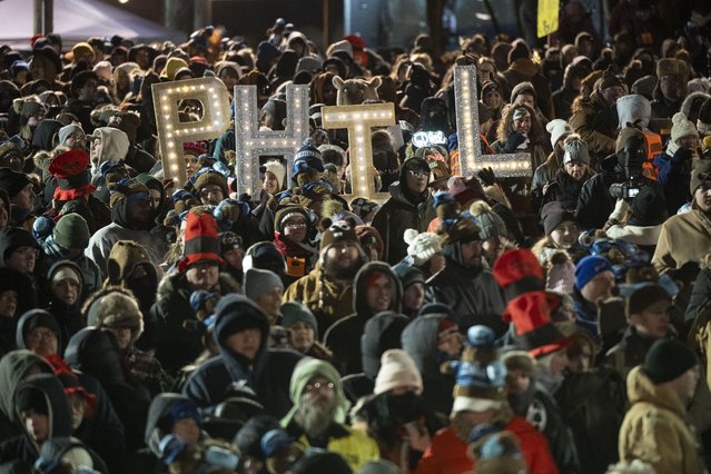 Groundhog Club handler A.J. Dereume holds Punxsutawney Phil, the weather prognosticating groundhog, during the 139th celebration of Groundhog Day on Gobbler's Knob in Punxsutawney, Pennsylvania on February 2, 2025. Phil's handlers said that the groundhog has forecast six more weeks of winter. (Photo by Mostafa Bassim/Anadolu via Getty Images)