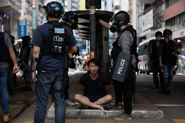 Police detain a protester during a rally against the implementation of the national security law in Hong Kong, China, 24 May 2020. Beijing unveiled a resolution at the opening of its annual legislative sessions that will bypass Hong Kong's legislature to outlaw acts of secession, subversion and terrorism in Hong Kong. (Photo by Jerome Favre/EPA/EFE)