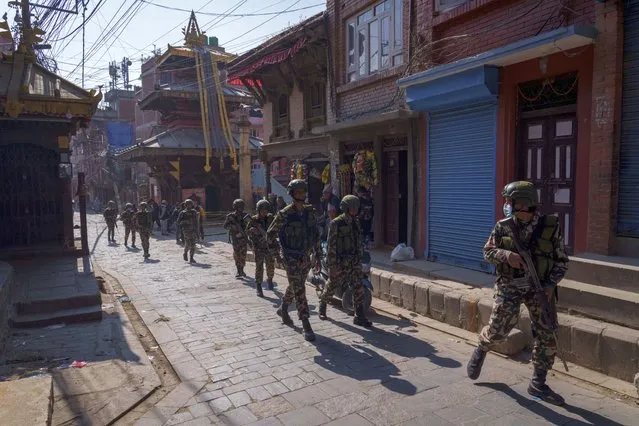 Nepalese army men patrol near polling stations a day prior to general elections in Bhaktapur, Nepal, Saturday, November 19, 2022. (Photo by Niranjan Shrestha/AP Photo)