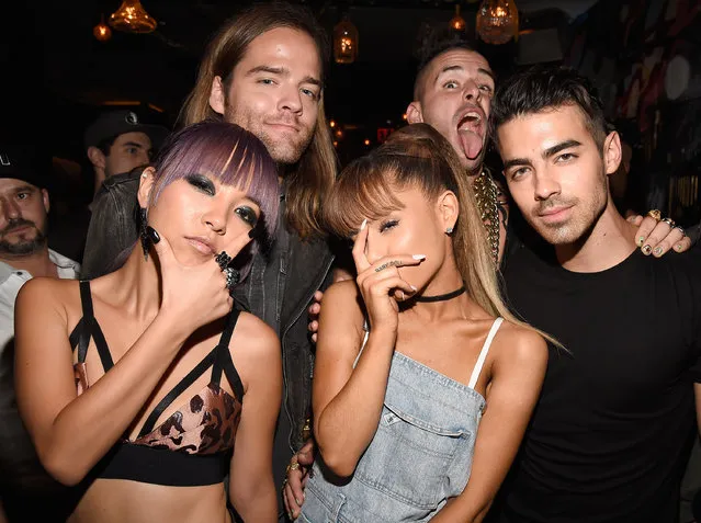 (L-R) JinJoo Lee, Jack Lawles, Cole Whittle, and Joe Jonas of DNCE pose with singer Ariana Grande (C) duringthe 2016 MTV Video Music Awards Republic Records After Party on August 28, 2016 in New York City. (Photo by Kevin Mazur/WireImage)