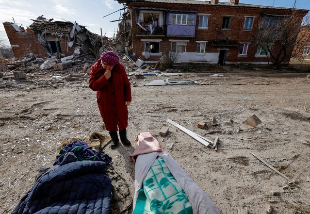 Local resident Lyudmila Timura, 72, mourns over the body of her granddaughter Lera Sukhanova, 15, who was killed by recent shelling in the course of Russia-Ukraine conflict in the settlement of Panteleimonivka in the Donetsk region, Russian-controlled Ukraine on February 17, 2024. (Photo by Alexander Ermochenko/Reuters)