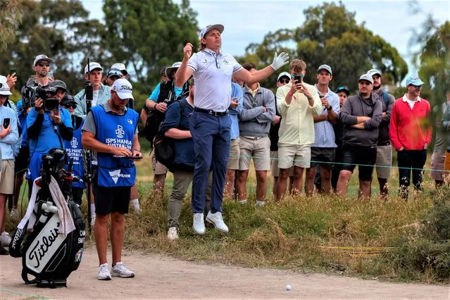 Australia's Cameron Smith leaps in the air to view the green after playing an errant shot on the 18th hole during the Australian Open golf championship at Victoria golf course in Melbourne, Australia, Thursday, December 1, 2022. (Photo by Asanka Brendon Ratnayake/AP Photo)