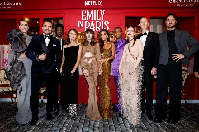 Kate Walsh, William Abadie, Philippine Leroy-Beaulieu, Samuel Arnold, Lily Collins, Ashley Park, Lucien Laviscount, Camille Razat, Bruno Gouery and Lucas Bravo attend the world premiere of the third season of the Netflix series “Emily in Paris” at the Theatre des Champs Elysees in Paris, France on December 6, 2022. (Photo by Benoit Tessier/Reuters)