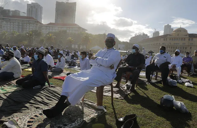 Sri Lankan Muslims attend a prayer session to mark Eid al-Adha, or Feast of Sacrifice, in Colombo, Sri Lanka, Saturday, August 1, 2020. The feast is marked by sacrificing animals to commemorate the prophet Ibrahim's faith in being willing to sacrifice his son. (Photo by Eranga Jayawardena/AP Photo)