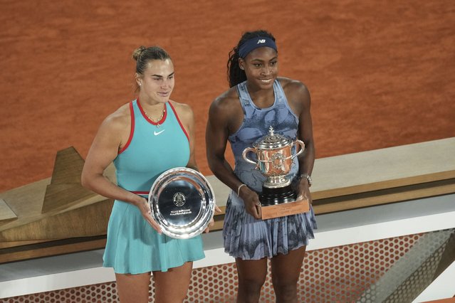 Winner Coco Gauff of the U.S., right, and second placed Aryna Sabalenka of Belarus pose with their trophies after the final match of the French Tennis Open at the Roland-Garros stadium in Paris, Saturday, June 7, 2025. (Photo by Christophe Ena/AP Photo)