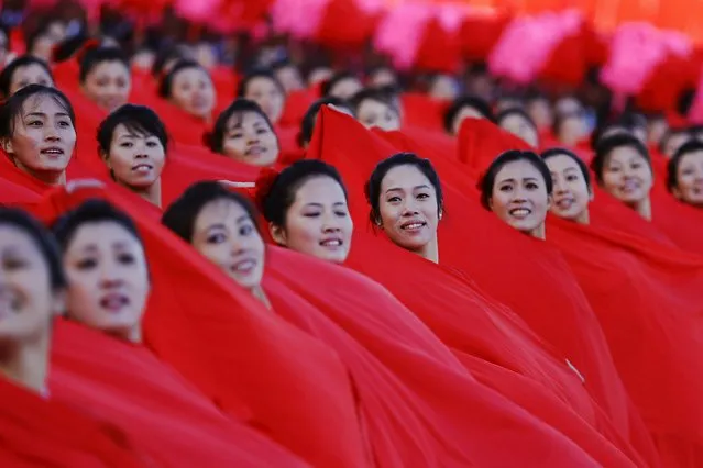 Girls perform in front of a stand with North Korean leader Kim Jong Un during the parade celebrating the 70th anniversary of the founding of the ruling Workers' Party of Korea, in Pyongyang October 10, 2015. (Photo by Damir Sagolj/Reuters)