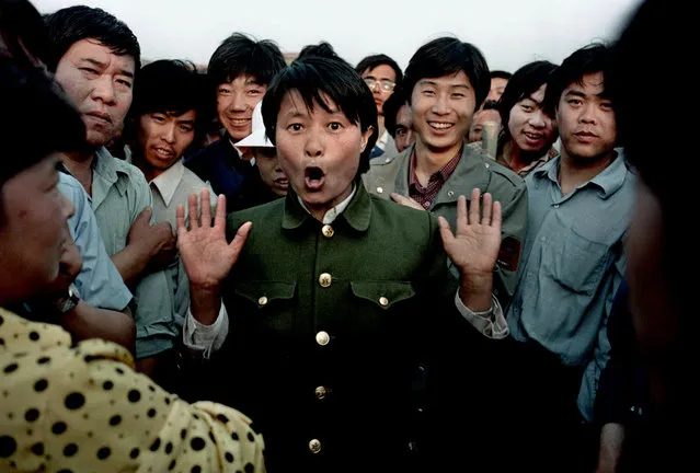 In this June 2, 1989 file photo, a woman soldier sings among pro-democracy protesters occupying Beijing's Tiananmen Square. Police and military would occasionally mix with protesters in an attempt to keep the demonstration peaceful. Over seven weeks in 1989, the student-led pro-democracy protests centered on Beijing’s Tiananmen Square became China’s greatest political upheaval since the end of the decade-long Cultural Revolution more than a decade earlier. (Photo by Jeff Widener/AP Photo/File)