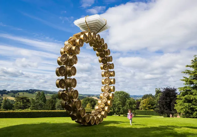 Visitor Nellie Brockway, 3, runs past a work titled “Solitaire” by artist Joana Vasconcelos as the Yorkshire Sculpture Park in Wakefield, Yorkshire on July 29, 2020, reopens today after being closed since the Coronavirus lockdown began. (Photo by Danny Lawson/PA Images via Getty Images)