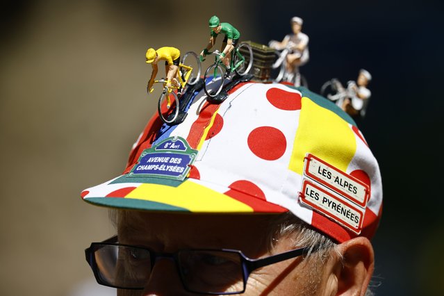A fan wearing a cap stands at the finish line of the 5th stage of the Tour de France cycling race, an Individual Time Trial over 33km in Caen, France, 09 July 2025. (Photo by Martin Divisek/EPA)