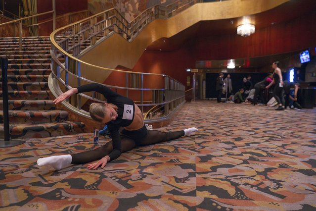 Emily Whiteford, 18, of Maryland, stretches before her audition for the Radio City Rockettes at Radio City Music Hall, Wednesday, April 3, 2024 in New York. (Photo by Brittainy Newman/AP Photo)