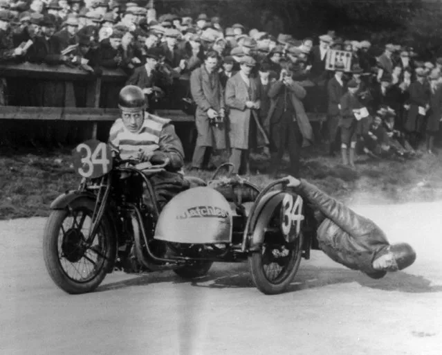 Action during the Bristol Cup Race for motorcycles with sidecars, showing F.R. Blackpeel cornering, March 20, 1928. Note passenger's face is almost touching the ground. (Photo by AP Photo)