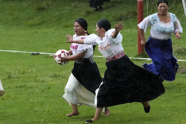 Sissa de la Cruz, left, and Sisa Guandinango, fight for the ball during a “handball with anaco” match in the Indigenous community of Turucu, Ecuador, Friday, June 14, 2024. One year ago, a group of women decided to create a new version of soccer: handball with anaco, an ancient skirt worn by Indigenous women. (Photo by Dolores Ochoa/AP Photo)