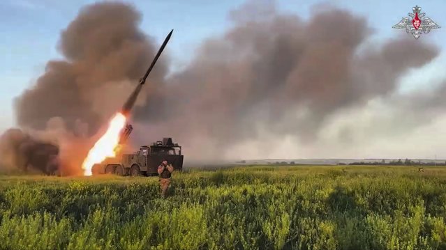 In this photo taken from video distributed by Russian Defense Ministry Press Service on Thursday, July 17, 2025, a Russian self-propelled multiple rocket launcher fires towards a Ukrainian position in Ukraine. (Photo by Russian Defense Ministry Press Service via AP Photo)