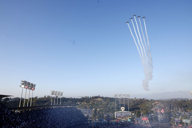 Vintage airplanes fly over the stadium before game three of the MLB World Series between the Toronto Blue Jays and the Los Angeles Dodgers in Los Angeles, California, USA, 27 October 2025. (Photo by Caroline Brehman/EPA)