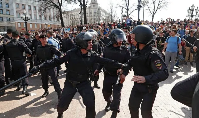 Russian riot policemen react to the tense situation during an unauthorized liberal opposition rally, called by their leader Alexei Navalny, prior to the official inauguration of president Putin, in Moscow, 05 May 2018. Russian opposition activists are continuing their protests against the re-election of president Vladimir Putin in March 2018. (Photo by Sergei Ilnitsky/EPA/EFE/Rex Features/Shutterstock)