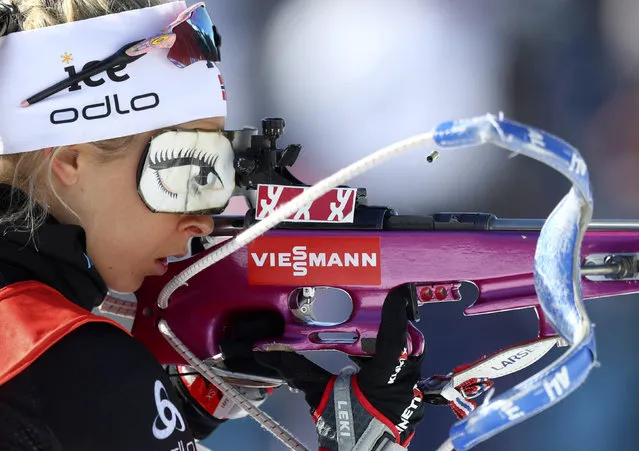 A spent cartridge pops out of the rifle of Ingrid Landmark Tandrevold of Norway during warmup before the women's 4x6 km relay competition at the Biathlon World Championships in Antholz, Italy, Saturday, February 22, 2020. (Photo by Matthias Schrader/AP Photo)