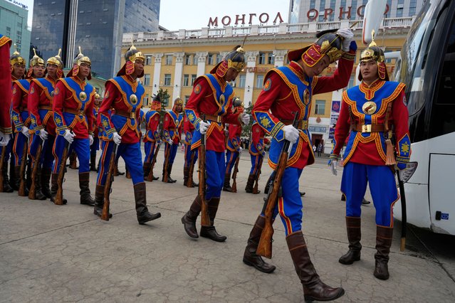 Members of a Mongolian honor guard leave after a ceremony marking the first session of the newly elected Parliament in front of the Government Palace on Sukhbaatar Square in Ulaanbaatar, Mongolia, Tuesday, July 2, 2024. (Photo by Ng Han Guan/AP Photo)