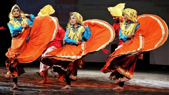 Artists from Haryana state perform their folk dance during a five-day national folk dance festival in Jammu, India, 26 December 2020. Folk dance artists from eleven states and the Union Territories of India are participating in the festival in the Union Territory of Jammu and Kashmir. (Photo by Jaipal Singh/EPA/EFE)