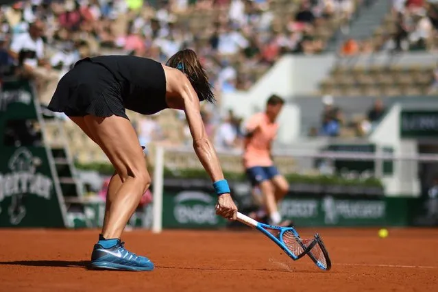 Australia's Ajla Tomljanovic smashes her racquet into the court after a point against Ukraine's Elina Svitolina during their women's singles first round match on day one of The Roland Garros 2018 French Open tennis tournament in Paris on May 27, 2018. (Photo by Eric Feferberg/AFP Photo)