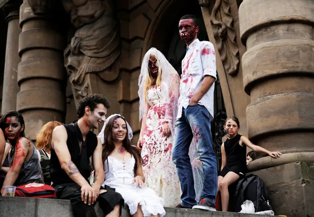 People dressed as zombies participate in a Zombie Walk in Sao Paulo, Brazil, November 2, 2016. (Photo by Nacho Doce/Reuters)