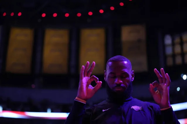 Los Angeles Lakers forward LeBron James gestures after the national anthem was played before Game 4 of the NBA basketball Western Conference Final series against the Denver Nuggets Monday, May 22, 2023, in Los Angeles. (Photo by Ashley Landis/AP Photo)