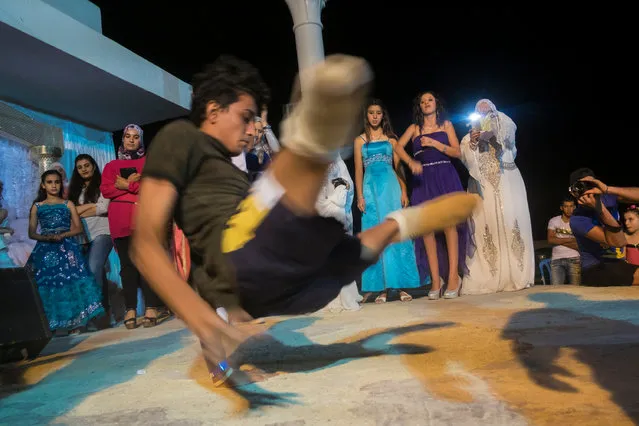 He performs his moves during the wedding celebrations, with his prosthetic limbs removed. (Photo by Yassine Alaoui Ismaili/The Guardian)