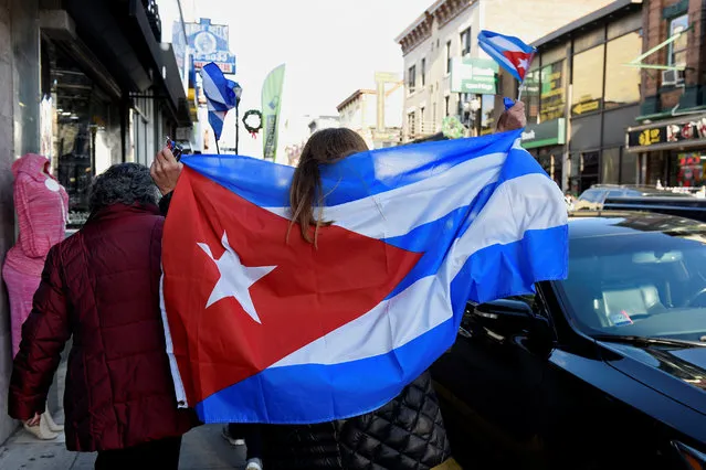 Irma Meneve (R) and Elena Fleites (L) celebrate the news of the death of  Cuban revolutionary leader Fidel Castro in Union City, New Jersey, U.S., November 26, 2016. (Photo by Darren Ornitz/Reuters)