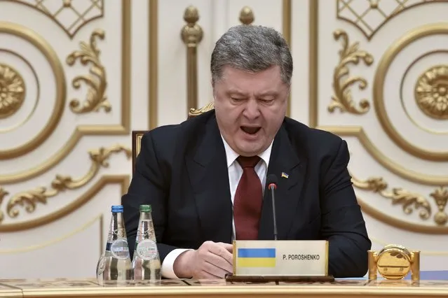 Ukraine's President Petro Poroshenko yawns as he takes part in peace talks on resolving the Ukrainian crisis in Minsk, February 11, 2015. (Photo by Kirill Kudryavtsev/Reuters)