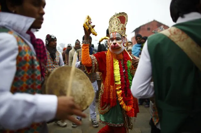 Hindu holy man, or sadhu, dances as he chants the name of Lord Shiva during a religious rally on the premises of Pashupatinath Temple in Kathmandu February 15, 2015. (Photo by Navesh Chitrakar/Reuters)