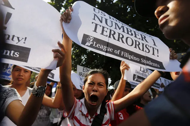 Filipino protestors stage a picket against the legality of the Enhanced Defense Cooperation Agreement (EDCA) in front of the US embassy in Manila, Philippines, 13 January 2016. An agreement allowing the increased presence of US military forces for training in the Philippines is constitutional, the South-East Asian country's Supreme Court decided. The decision came amid increasing tension between China and the Philippines over a territorial row in the South China Sea. (Photo by Francis R. Malasig/EPA)
