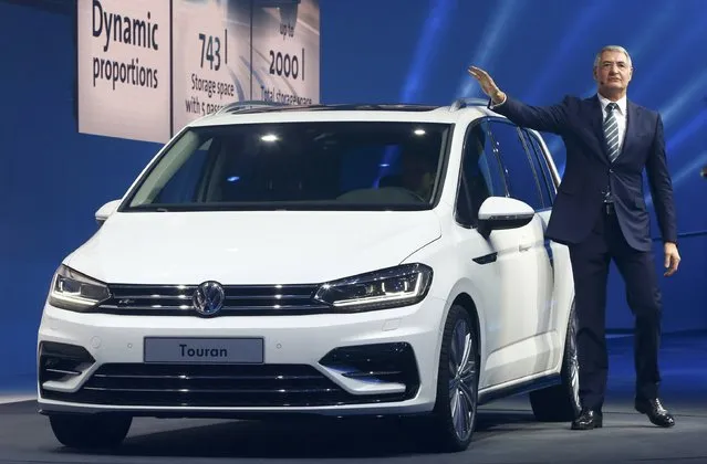 Heinz-Jakob Neusser, VW Head of Technical Development, speaks next to a new Touran car during a Volkswagen Group event ahead of the 85th International Motor Show in Geneva, March 2, 2015.                       REUTERS/Arnd Wiegmann (SWITZERLAND  - Tags: TRANSPORT BUSINESS)  