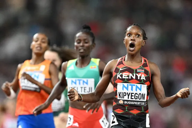 Kenya's Faith Kipyegon celebrates winning the women's 1500m final during the World Athletics Championships at the National Athletics Centre in Budapest on August 22, 2023. (Photo by Jewel Samad/AFP Photo)