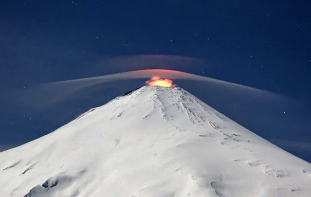 View of the Villarrica volcano as seen from Villarrica, some 800 kilometres south of Santiago, Chile, on September 27, 2023. Villarrica is among the most active volcanoes in South America. (Photo by Sebastian Escobar/AFP Photo)