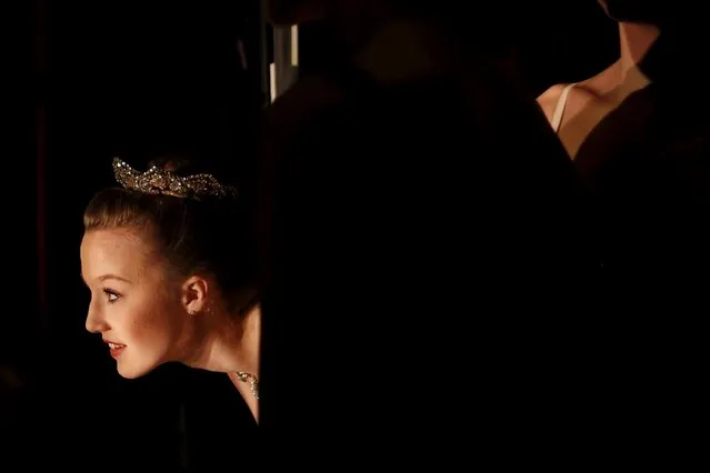 Chloe Ellis, a student from the School of American Ballet, watches fellow students dance during a performance at the Queens Theatre in the Queens borough of New York February 28, 2016. (Photo by Shannon Stapleton/Reuters)