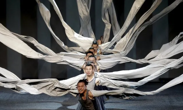 China's Contemporary Dragon Kungfu Company dancers with the show “Gateway” perform in Riga, Latvia, May 5, 2015. (Photo by Ints Kalnins/Reuters)
