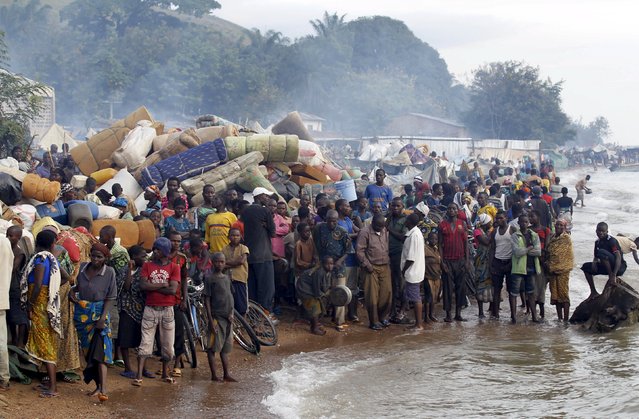 Burundian refugees gather on the shores of Lake Tanganyika in Kagunga village in Kigoma region in western Tanzania, as they wait for MV Liemba to transport them to Kigoma township, May 17, 2015. (Photo by Thomas Mukoya/Reuters)